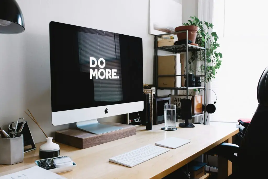 Computer table with a laptop and chair set up in a modern workspace, ideal for running a small online business or working from home.