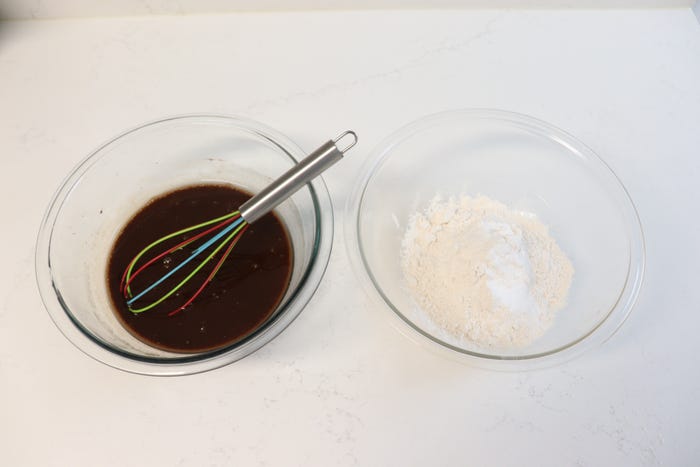 The wet and dry ingredients for chocolate cake.